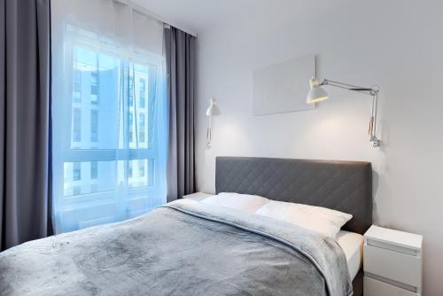 Krevet ili kreveti u jedinici u okviru objekta Apartament Dembowskiego - Unique Apartments