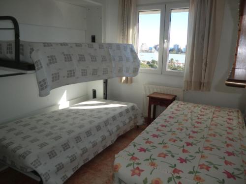 Postel nebo postele na pokoji v ubytování EDIFICIO OASIS