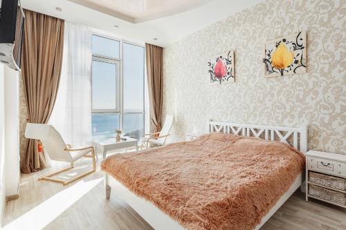 En eller flere senge i et værelse på Apartments Arcadia Panorama of the sea