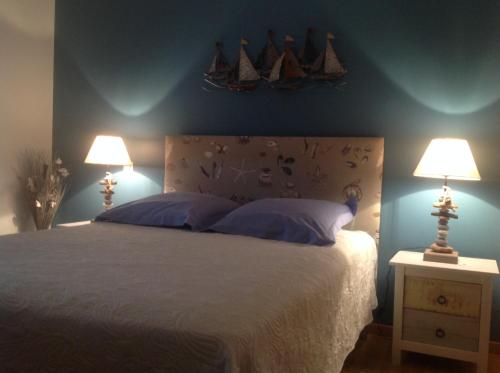 A bed or beds in a room at Chambres d'hôtes dans la baie du Mt St Michel