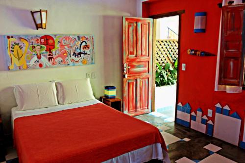 Un pat sau paturi într-o cameră la Art Hotel Aos Sinos Dos Anjos