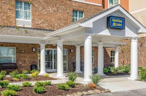 a hotel with a sign on the front of a building at MainStay Suites Hackberry Sportsman's Lodge in Hackberry