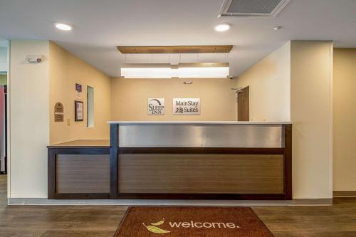 a lobby with a welcome sign on the wall at MainStay Suites Geismar - Gonzales in Geismar