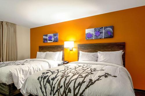 Ένα ή περισσότερα κρεβάτια σε δωμάτιο στο Sleep Inn Geismar - Gonzales