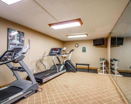 a gym with treadmills and ellipticals in a room at Clarion Inn & Suites Dothan South in Dothan