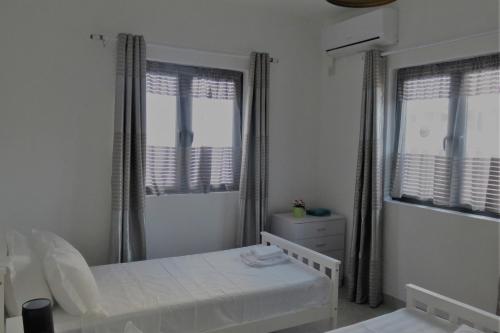 Giường trong phòng chung tại Ibiz Tourist Residence 2