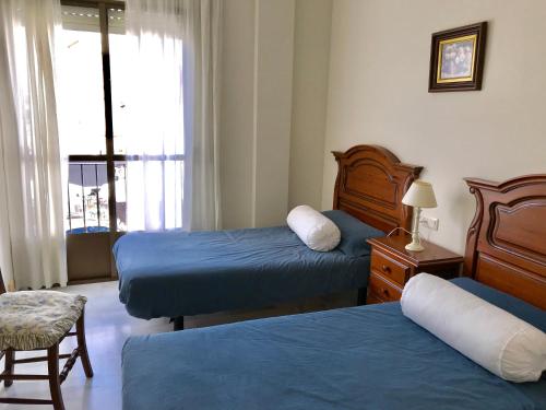 Кровать или кровати в номере Calle Valenzuela 9 La Rambla