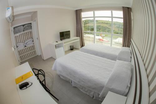 Cama ou camas em um quarto em HOTEL HPR
