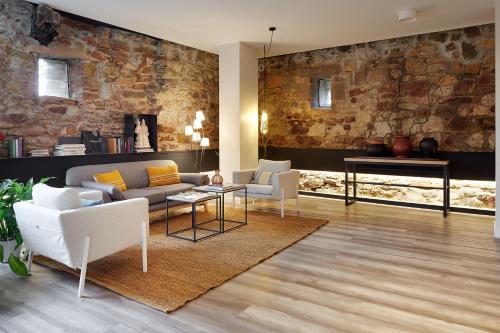 a living room with a couch and chairs and a table at Heredad de Unanue in Donostia-San Sebastián