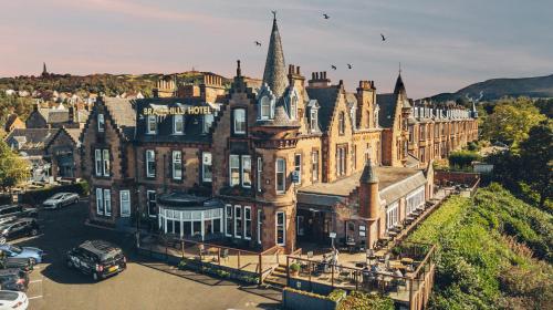an aerial view of a large building with turrets at Braid Hills Hotel in Edinburgh