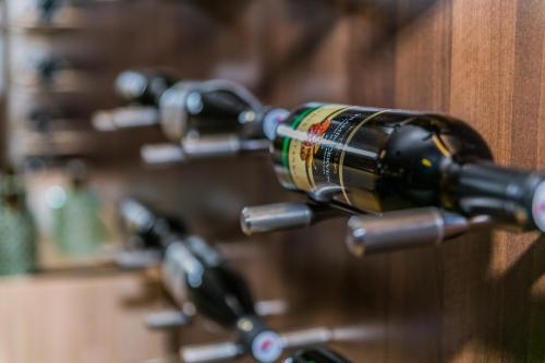 a row of wine bottles in a wine rack at Hotel Rezident in Turčianske Teplice