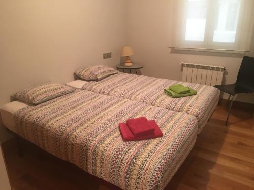 מיטה או מיטות בחדר ב-Real Unión by Basquelidays