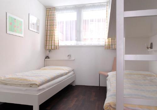 Un pat sau paturi într-o cameră la Apartment Topas