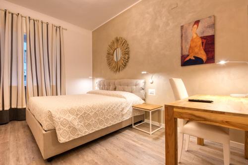 Cama ou camas em um quarto em Maison Castelli
