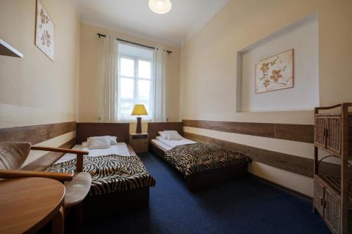 Postel nebo postele na pokoji v ubytování Red Carpet Hostel