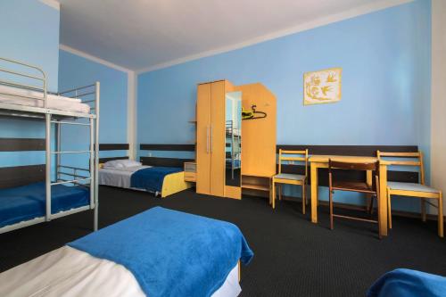 Postel nebo postele na pokoji v ubytování Red Carpet Hostel