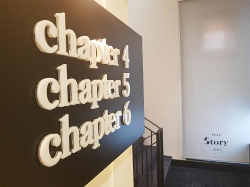 a sign for a store with the words chicago chapters chapters at Hotel Story in Sarajevo