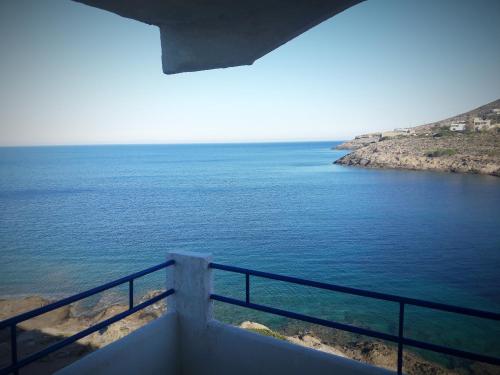 a view of the ocean from a balcony at Daskalio Beach Hotel in Keratea