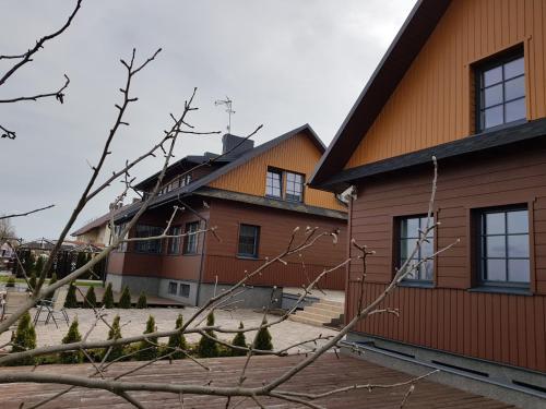 a building with a fence in front of it at Villa Traku Terasa in Trakai