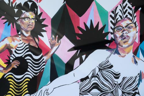 a mural of two people in front of a wall at Fairmont Royal Pavilion Barbados Resort in Saint James