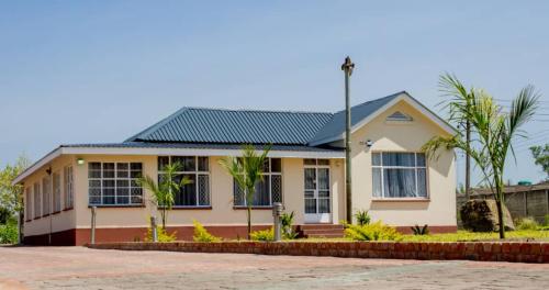 a house with a green roof at Lynm Residence in Harare