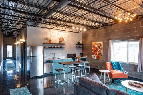 a kitchen and living room with a couch and a table at The Nelson Inn in Sheridan