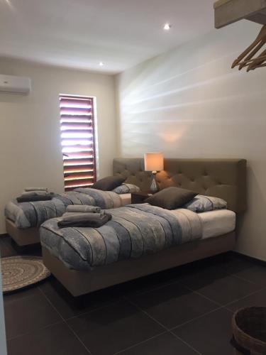 Letto o letti in una camera di Villa Sol Paraiso
