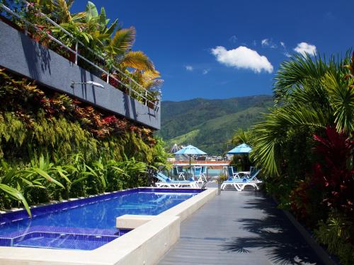 a swimming pool next to a building with a resort at Waldorf Hotel in Caracas