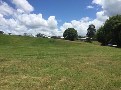a field of grass with at Yandina Caravan Park in Yandina