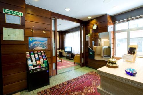a lobby with a soda machine in a building at Hotel Castilla in Gijón