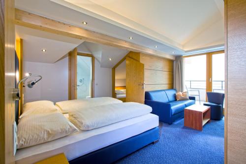 Postel nebo postele na pokoji v ubytování Hotel Lukas