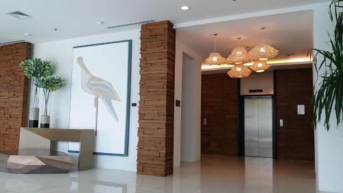 a lobby with a picture of a bird on the wall at Prime Sea View Condo in Davao in Davao City