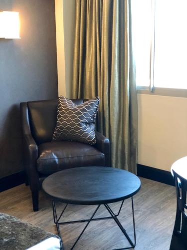 a living room with a couch and a coffee table at Belaire Suites Hotel in Durban