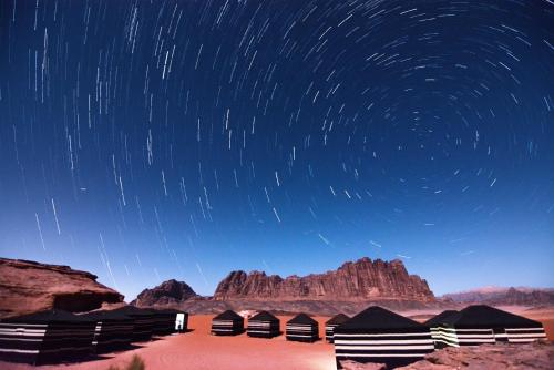 a starry night with star trails in the desert at Mohammed Mutlak Camp in Wadi Rum