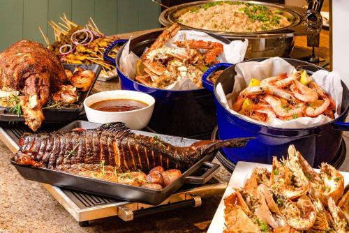 a buffet of different types of food on a table at JEN Penang Georgetown by Shangri-La in George Town