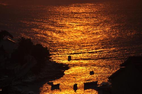 a view of the ocean at sunset at Guest House Stefica in Hvar