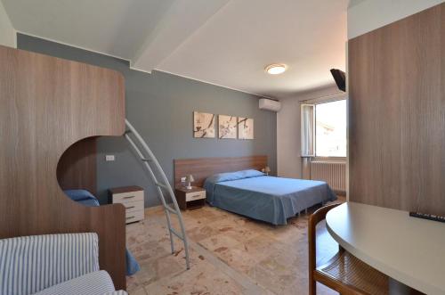 מיטה או מיטות בחדר ב-Albergo Della Torre