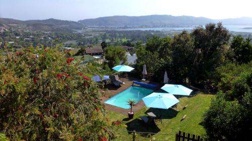 an aerial view of a villa with a pool and umbrellas at Panorama Lodge in Knysna