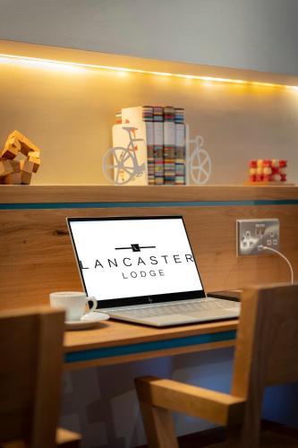 a laptop computer sitting on top of a desk at Lancaster Lodge in Cork