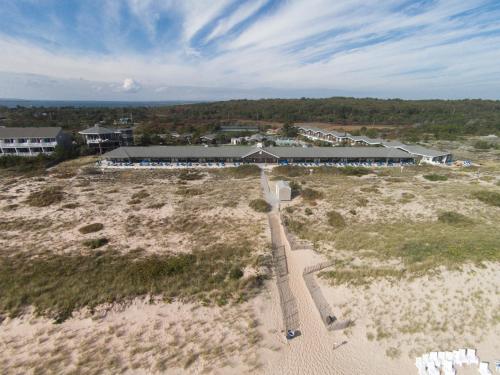 an aerial view of a building on a beach at Driftwood Resort on the Ocean in Montauk