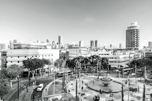 a black and white photo of a city with buildings at Cinema Hotel - an Atlas Boutique Hotel in Tel Aviv