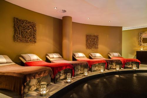 a room with a group of chairs and a tub at Arabella Hotel, Golf and Spa in Kleinmond