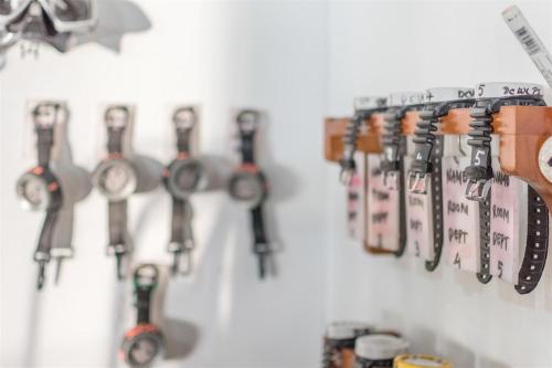 a bunch of keys hanging on a wall at Hotel Pondok Sari Beach & SPA Resort in Pemuteran