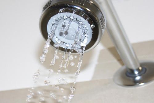 a sink with water coming out of a faucet at CityWalls Guest House Bergamo in Bergamo