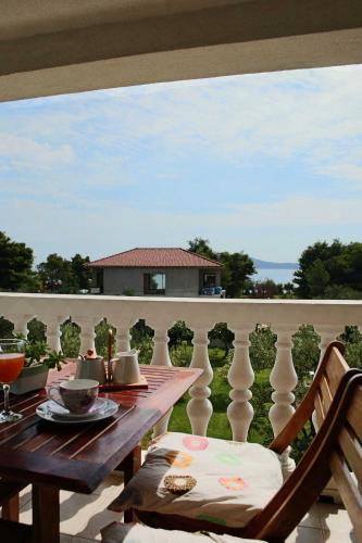 a table and chairs on a balcony with a view at Villa Spanja in Vodice
