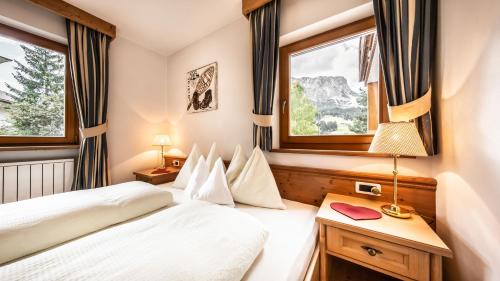 Postel nebo postele na pokoji v ubytování Apartments Chalet Maria