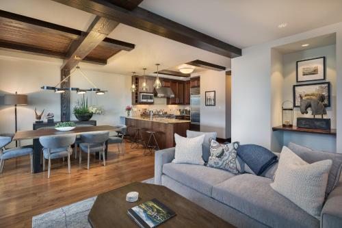 a living room with a couch and a table at Relais & Chateaux Lumiere by Dunton in Telluride