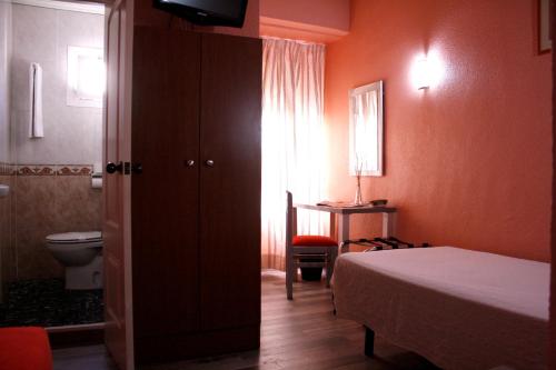 Кровать или кровати в номере Hotel Universal Murcia