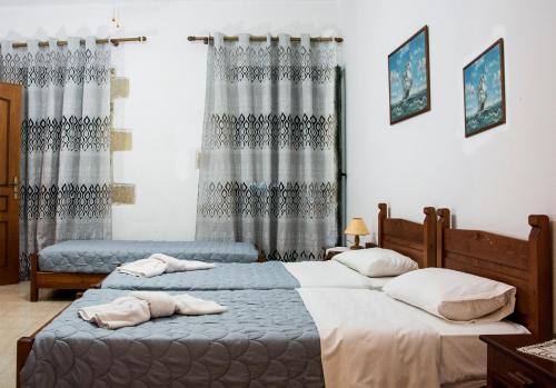 Voodi või voodid majutusasutuse Villa Dimitris toas
