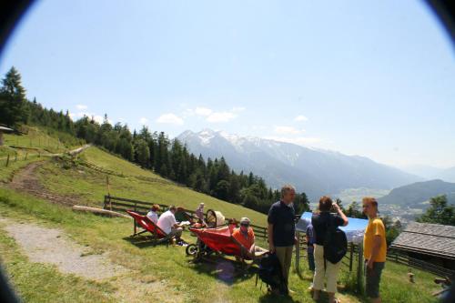 a group of people standing on top of a hill at Ropferhof in Telfs-Buchen